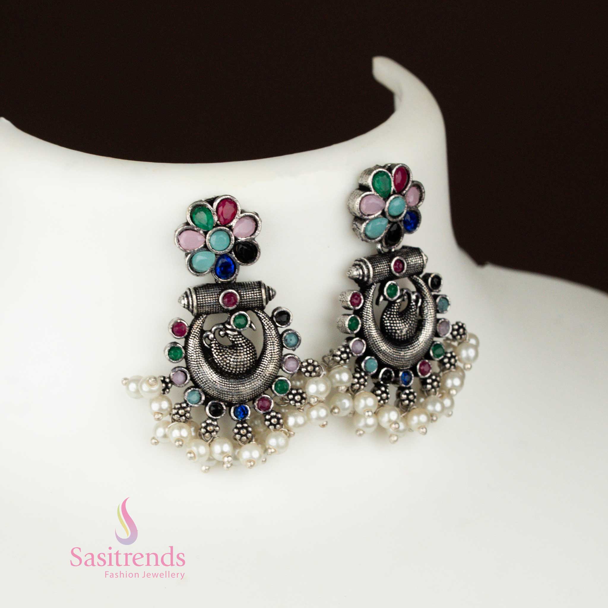 Ethnic oxidised silver Earrings with a multi-colour peacock chandbali pendant and coordinating stone-studded earrings, a boho tribal jewellery ensemble rich in cultural flair – Sasitrends