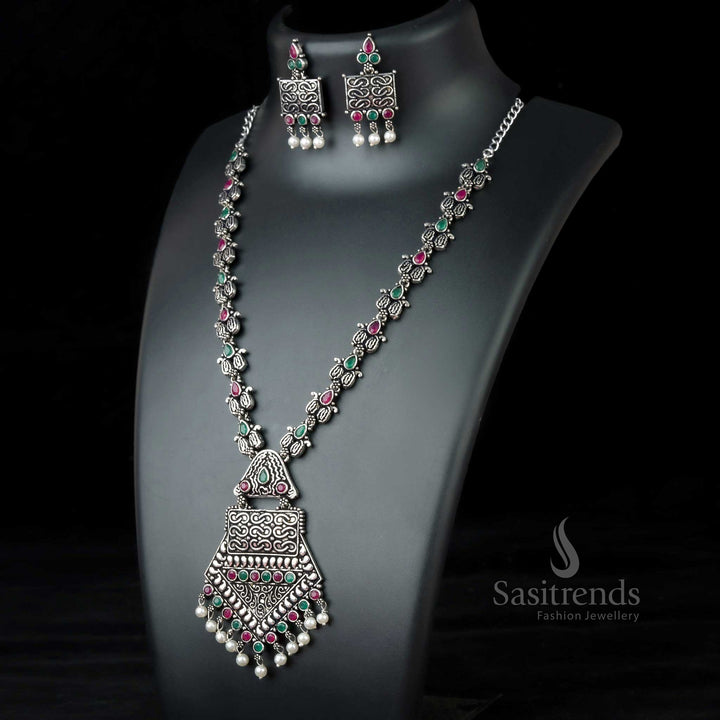 Bold Ruby-Green Tribal Pendant Necklace in oxidised German silver, adorned with glowing stones and classic pearls – Grand cultural jewellery by Sasitrends