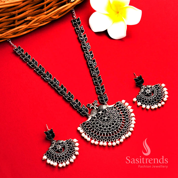 Bold black oxidised silver pearl long necklace with detailed peacock floral pendant and matching pearl earrings – ethnic jewellery set – Sasitrends