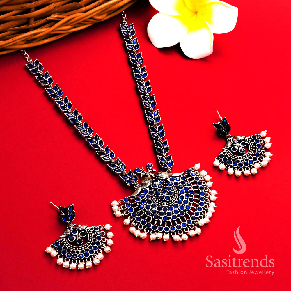 Trendy blue oxidised pearl necklace with peacock floral pendant and delicate pearl earrings – party wear traditional jewellery – Sasitrends