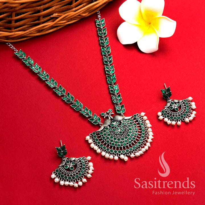Elegant green oxidised silver pearl long necklace with intricate peacock floral pendant and matching pearl earrings – traditional jewellery set – Sasitrends