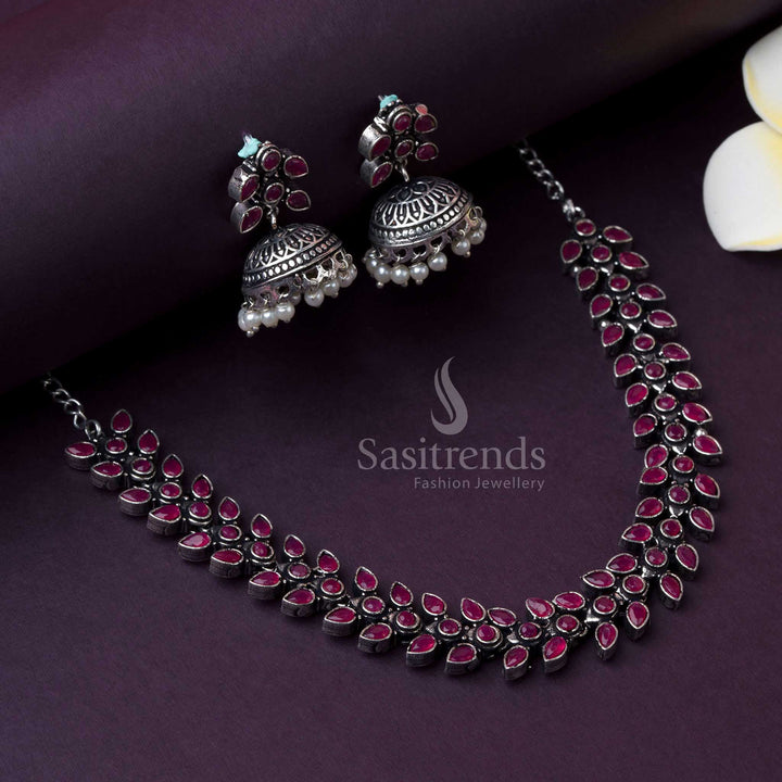 Oxidised ruby stone jewellery set in Madhavi design, adorned with pearl drops, radiating festive glam and vintage-inspired beauty for modern party style by Sasitrends