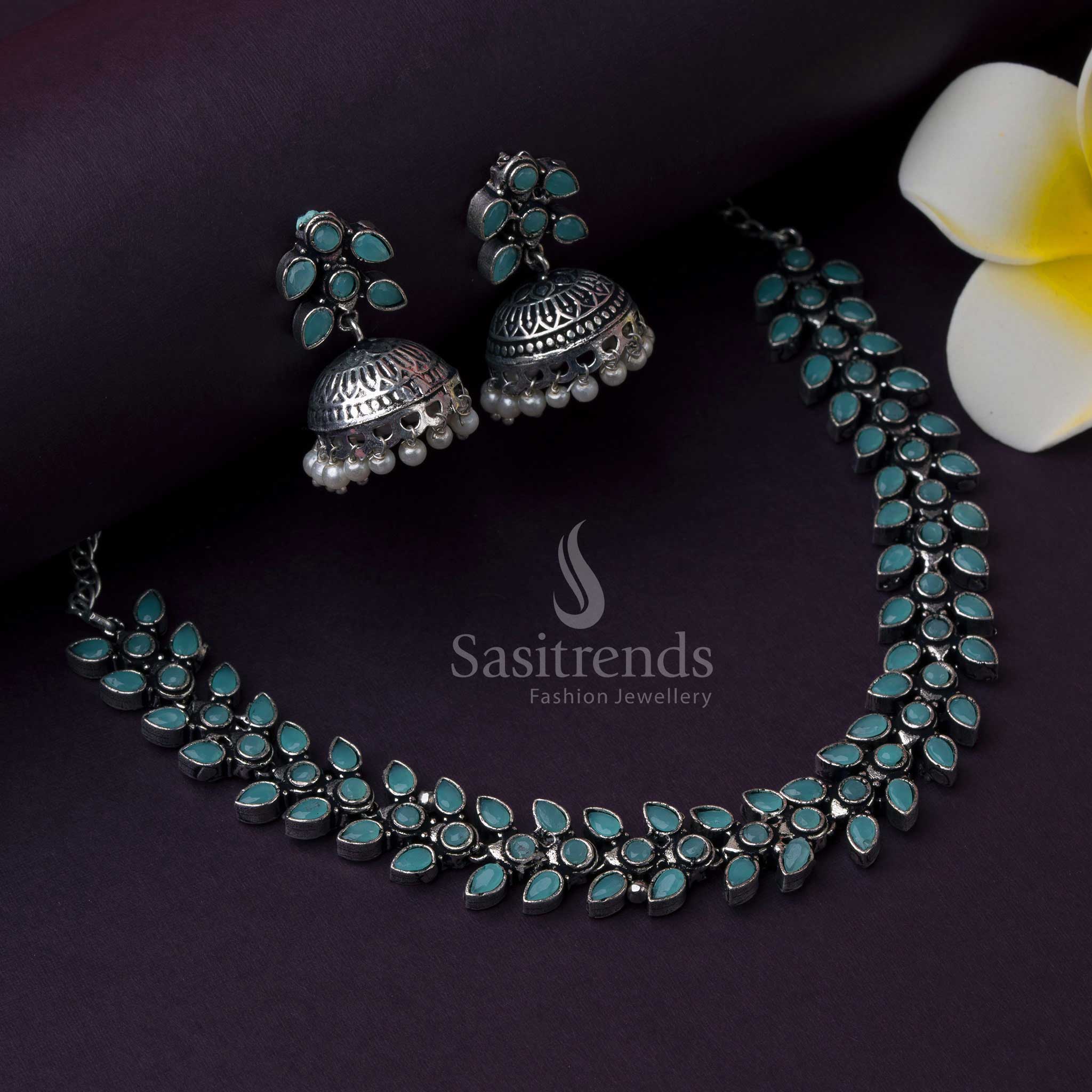 Mint green Madhavi oxidised jewellery set with pearl jhumkas, glowing with subtle shine, ethnic touch, and modern fusion aesthetic by Sasitrends