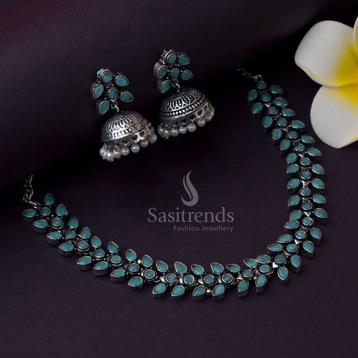 Mint green Madhavi oxidised jewellery set with pearl jhumkas, glowing with subtle shine, ethnic touch, and modern fusion aesthetic by Sasitrends