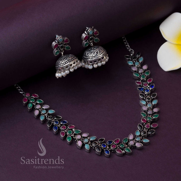 Black base Madhavi jewellery set with multi-coloured stones and pearl jhumkas, perfect for night party wear with traditional bold beauty and oxidised charm by Sasitrends