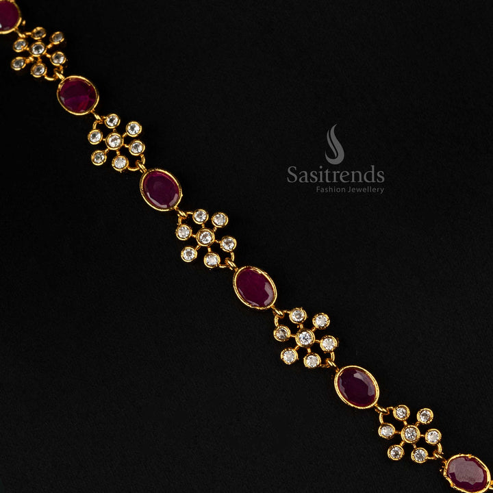 Luxurious ruby stone temple jewellery set with matte gold finish, floral and oval patterns, and shimmering American diamond embellishment - Sasitrends
