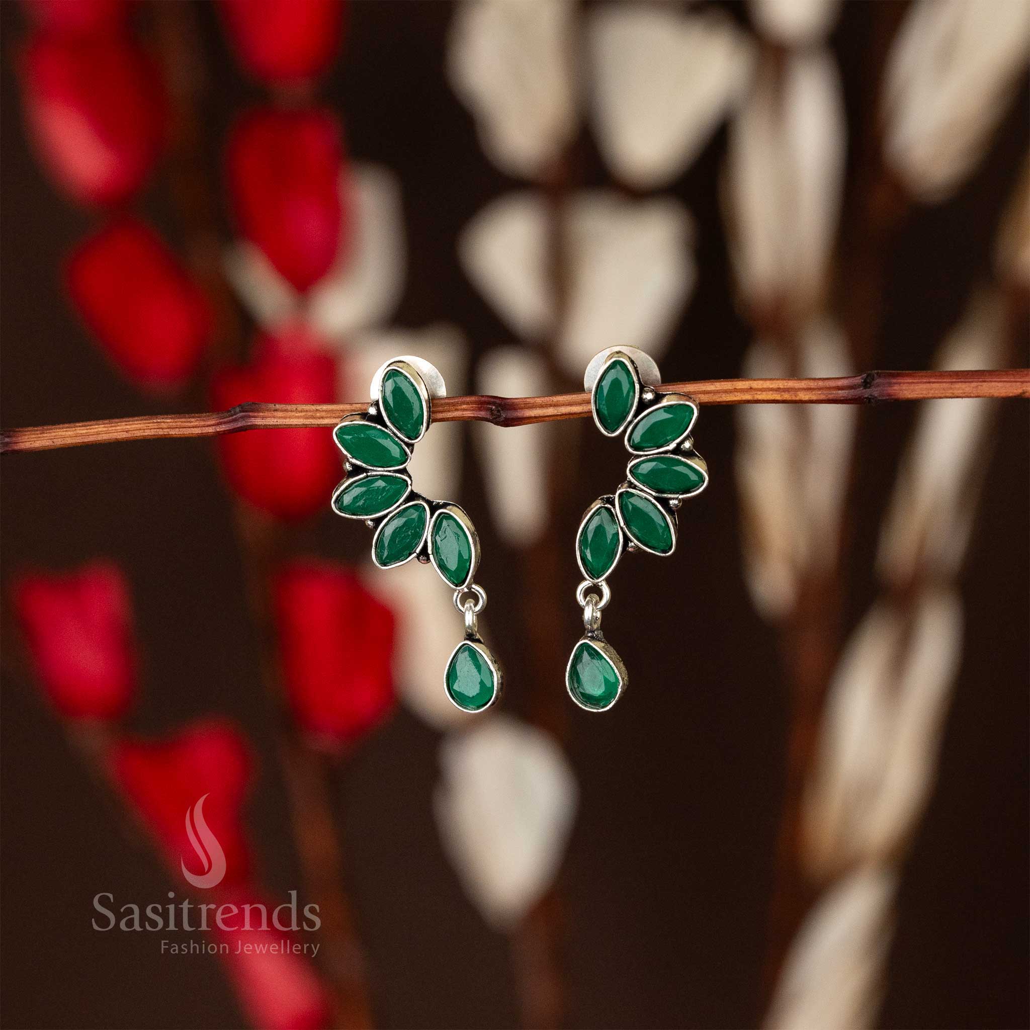 Trendy oxidised earrings with green marquise stones in leaf design and waterdrop accent sasitrends navarathiri special
