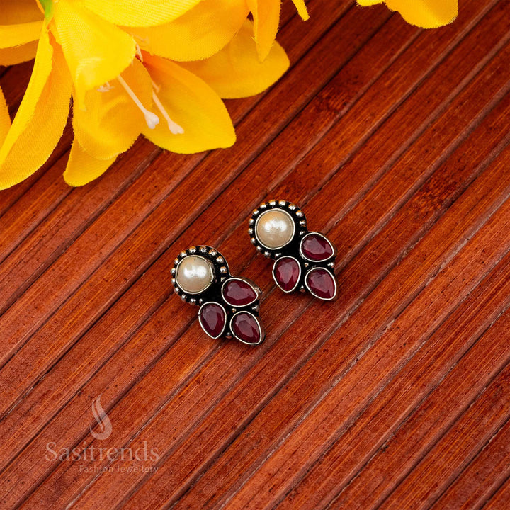 Oxidised earrings with central pearl and cascading ruby teardrop accents sasitrends online shopping