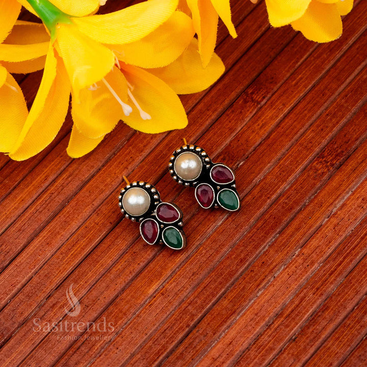 Latest oxidised earrings with central pearl and cascading ruby green waterdrop accents navarathiri elegance