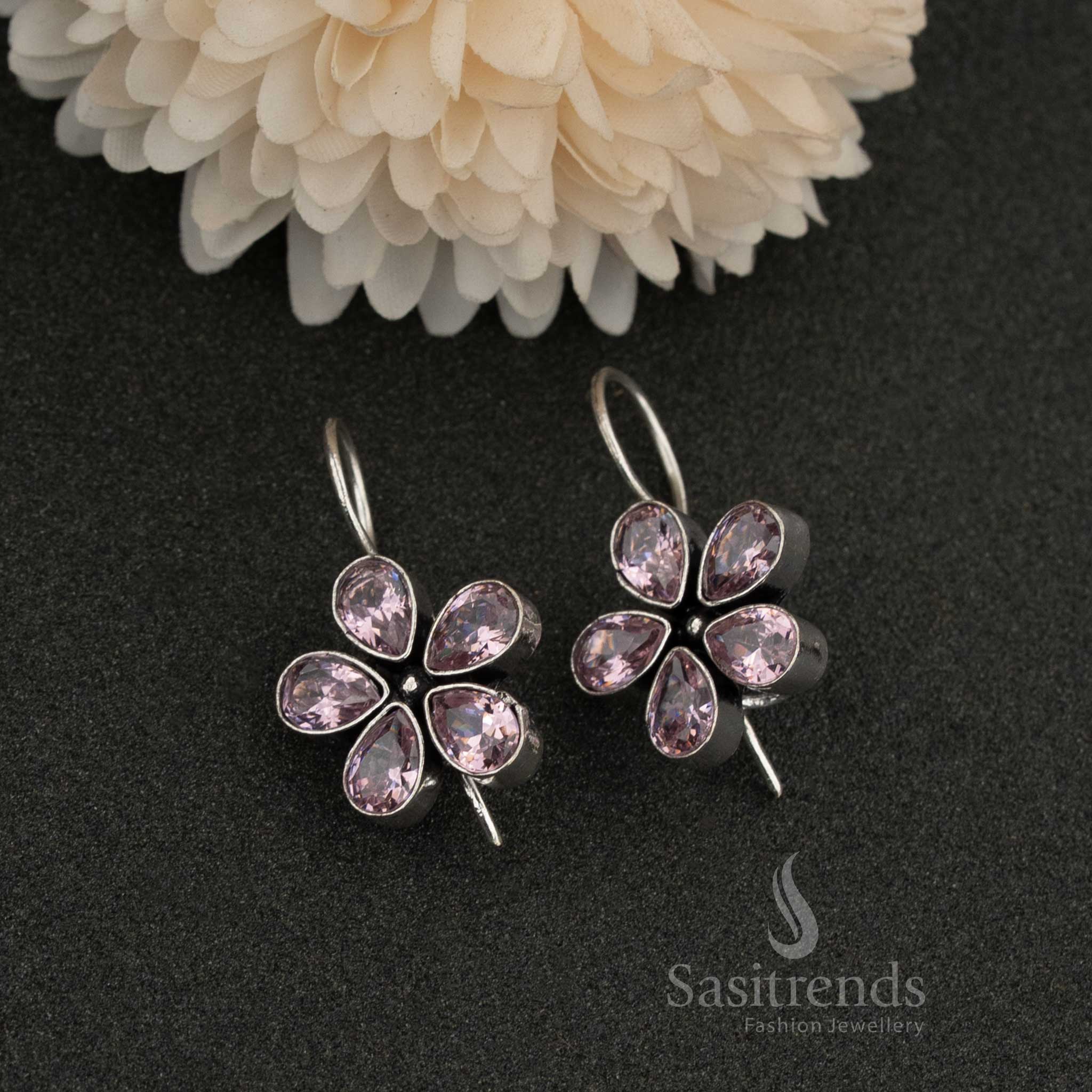 Oxidised petal-shaped earrings with  Pink stone accents on fishhook backs navarathiri elegance