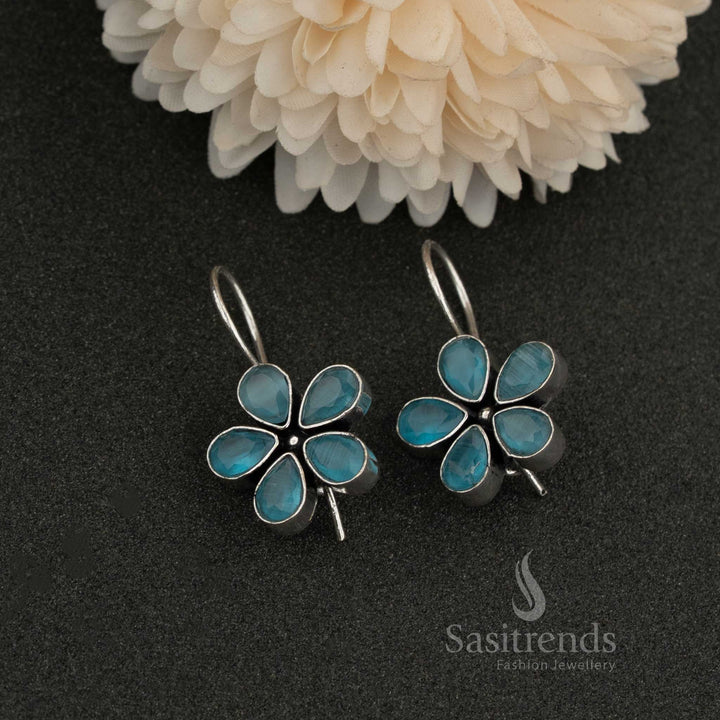 Oxidised petal-shaped earrings with Light Blue stone accents on fishhook backs navarathiri elegance