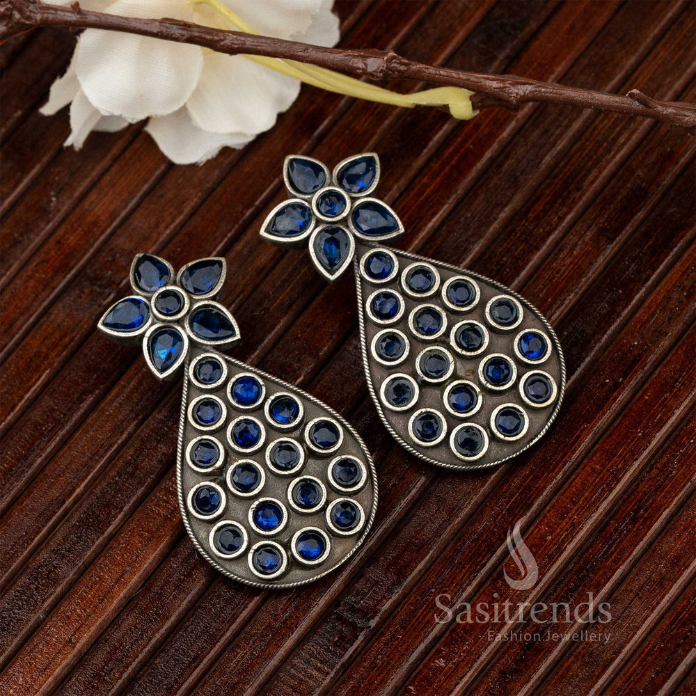 Stylish oxidised silver earrings with pear blue gemstone drops, intricate vine motif and earthy vintage jewellery aesthetic – perfect blend of ethnic and boho flair – Sasitrends