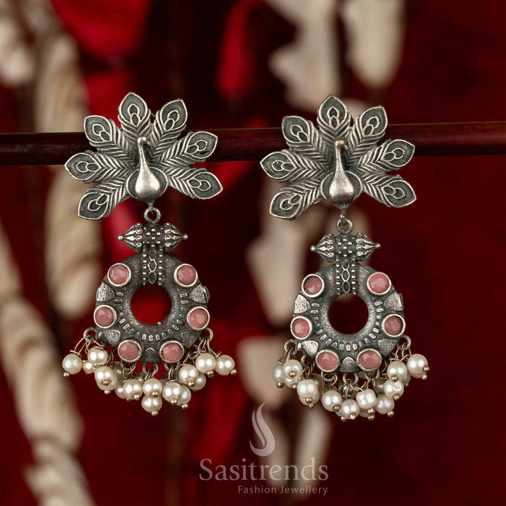 Vintage style oxidised earrings with pink gemstone detail, peacock wing design and dangling pearls – a timeless piece of traditional wear jewellery – Sasitrends