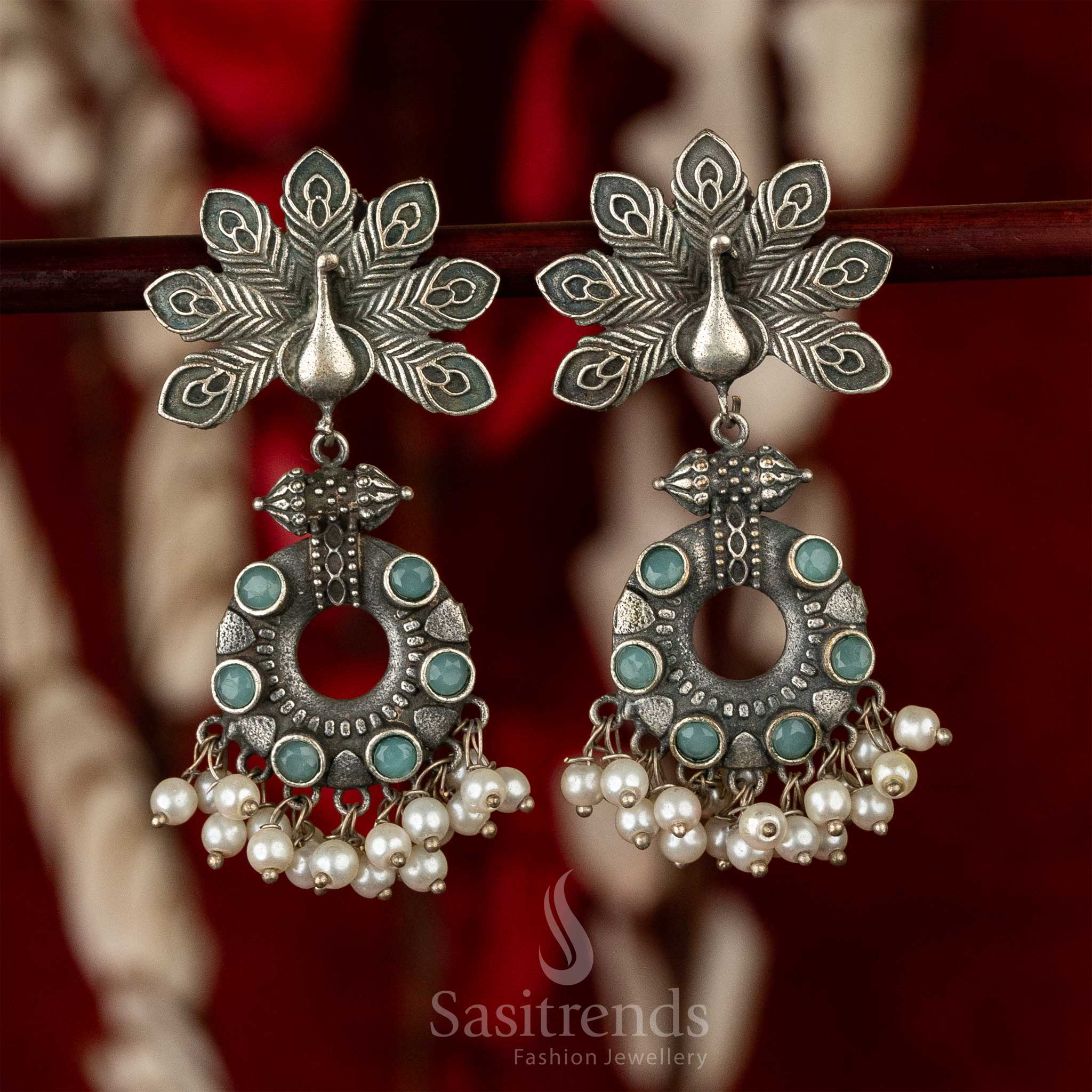 Refreshing mint peacock motif earrings in oxidised silver with classic pearl endings and subtle floral touch – a graceful ethnic jewellery piece – Sasitrends