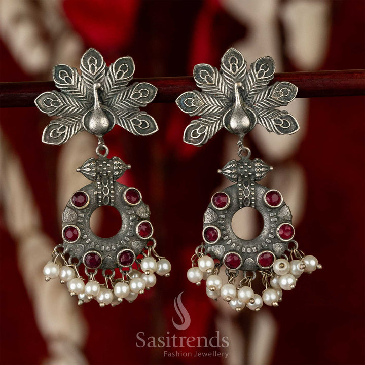 Bold oxidised earrings with peacock motif, ruby gemstone brilliance and pearl accents – perfect for royal traditional jewellery lovers – Sasitrends