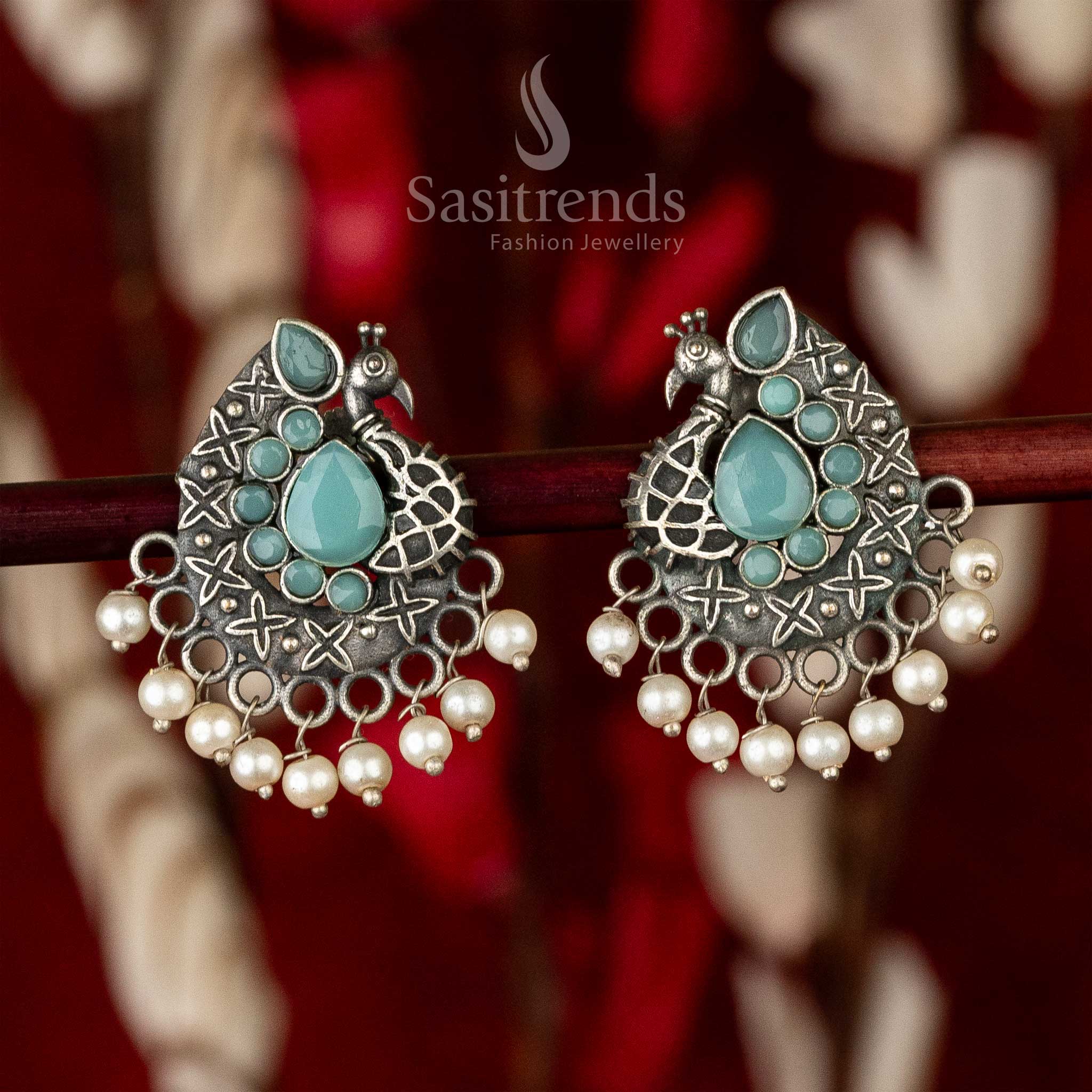 Mint waterdrop stone oxidised earrings with antique finish, peacock body silhouette and leafy accents – delicately handcrafted jewellery elegance – Sasitrends