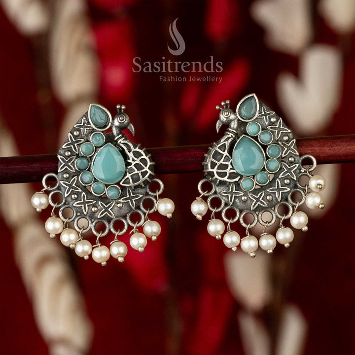 Mint waterdrop stone oxidised earrings with antique finish, peacock body silhouette and leafy accents – delicately handcrafted jewellery elegance – Sasitrends