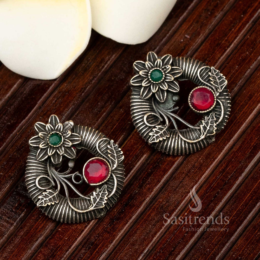 Elegant ruby-green floral oxidised silver stud earrings with petal-carved details and antique finish – perfect for traditional festive jewellery lovers – Sasitrends