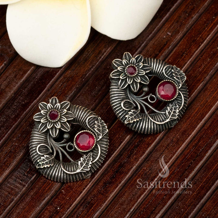 Ruby gem oxidised floral earrings with embossed petals and radiant centre finish – a timeless traditional women’s jewellery choice – Sasitrends