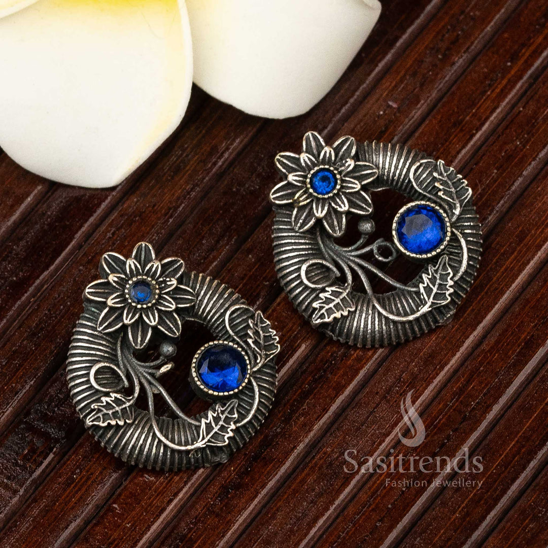 Blue petaled oxidised silver studs with gem-like centre and classic floral design – a bold statement piece of elegant jewellery – Sasitrends