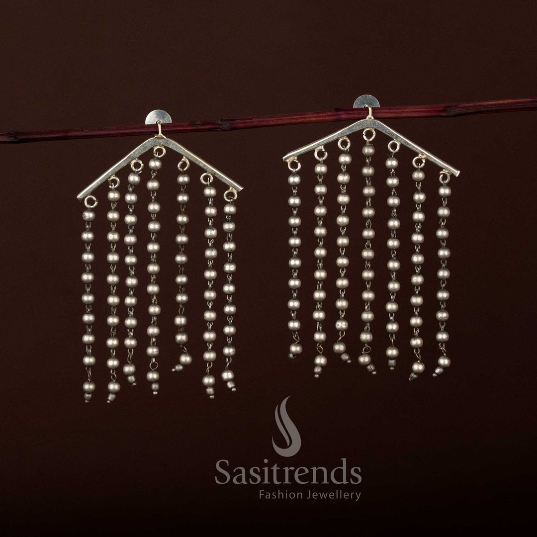 Sasitrends triangular oxidised silver earrings featuring a textured geometric design with cascading beaded fringe, showcasing ethnic heritage craftsmanship, premium oxidised detailing, and a bold statement style suitable for traditional and Indo-fusion wear - Sasitrends