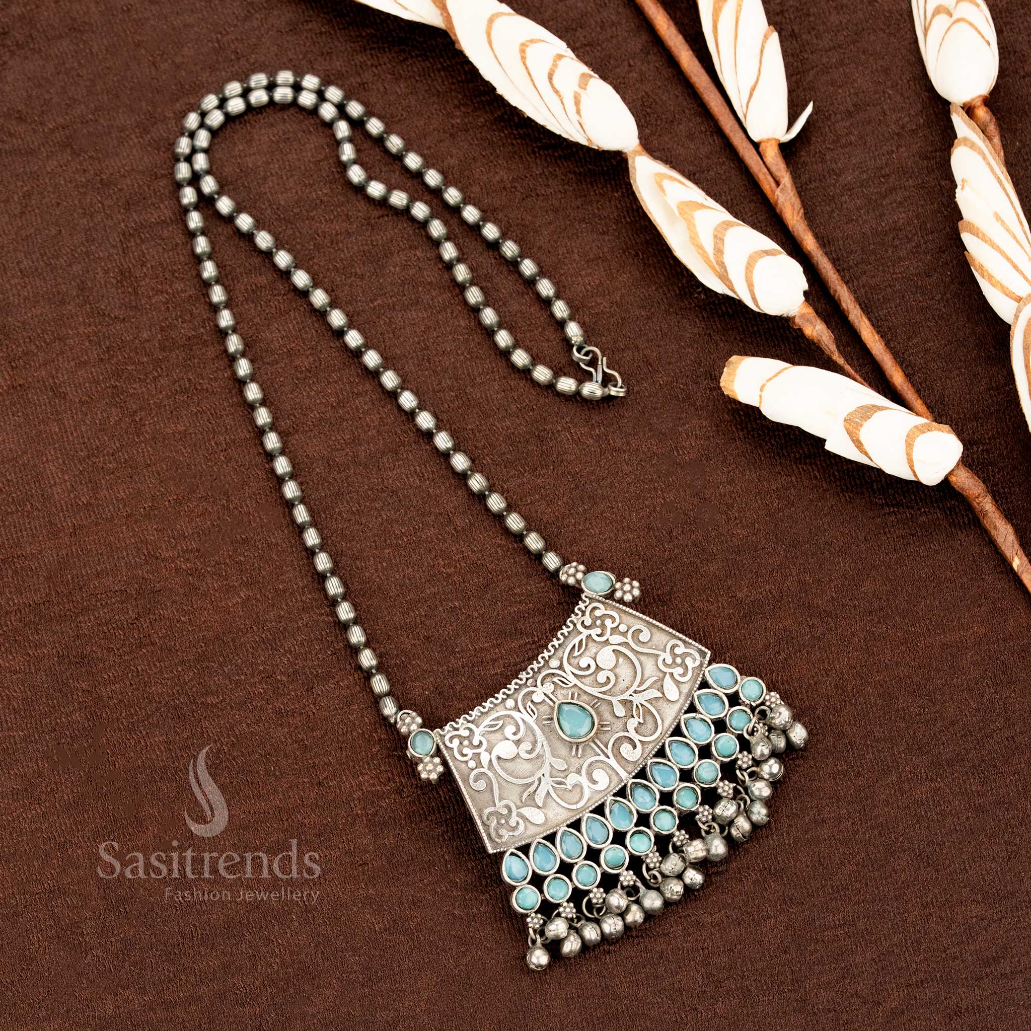 Heritage-inspired mint green oxidised floral necklace in German silver with ethnic pendant chain and antique silver tone for a tribal traditional look – Sasitrends