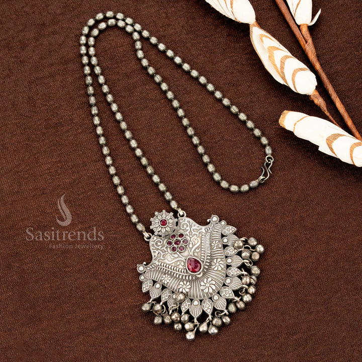 Traditional ruby pendant necklace crafted in oxidised German silver with floral engraving and old-style ball drops – an artisanal ethnic jewellery statement from Sasitrends