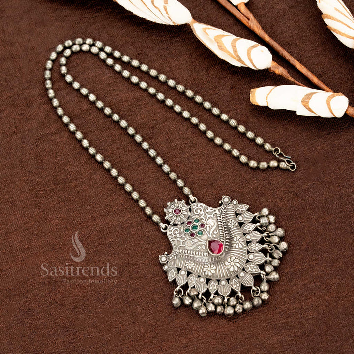 Ruby-green floral pendant necklace in oxidised German silver with delicate engraved details and handcrafted antique ball hangings – a graceful ethnic jewellery piece by Sasitrends