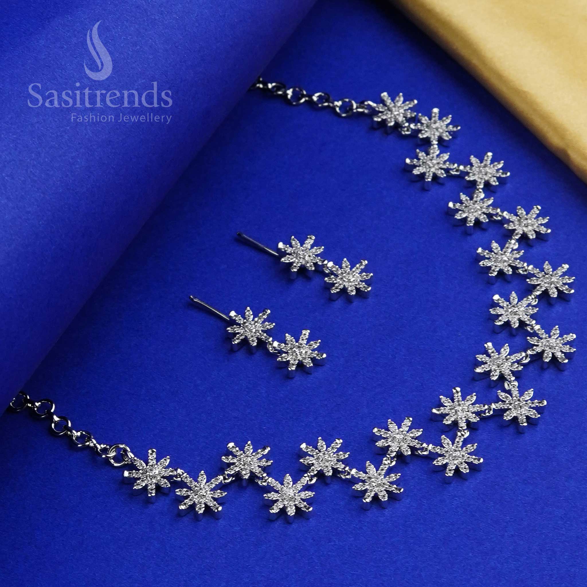 Graceful rhodium silver star floral CZ jewellery set embellished with dazzling American Diamond stones, a luxury fusion style ideal for festive and party wear - Sasitrends