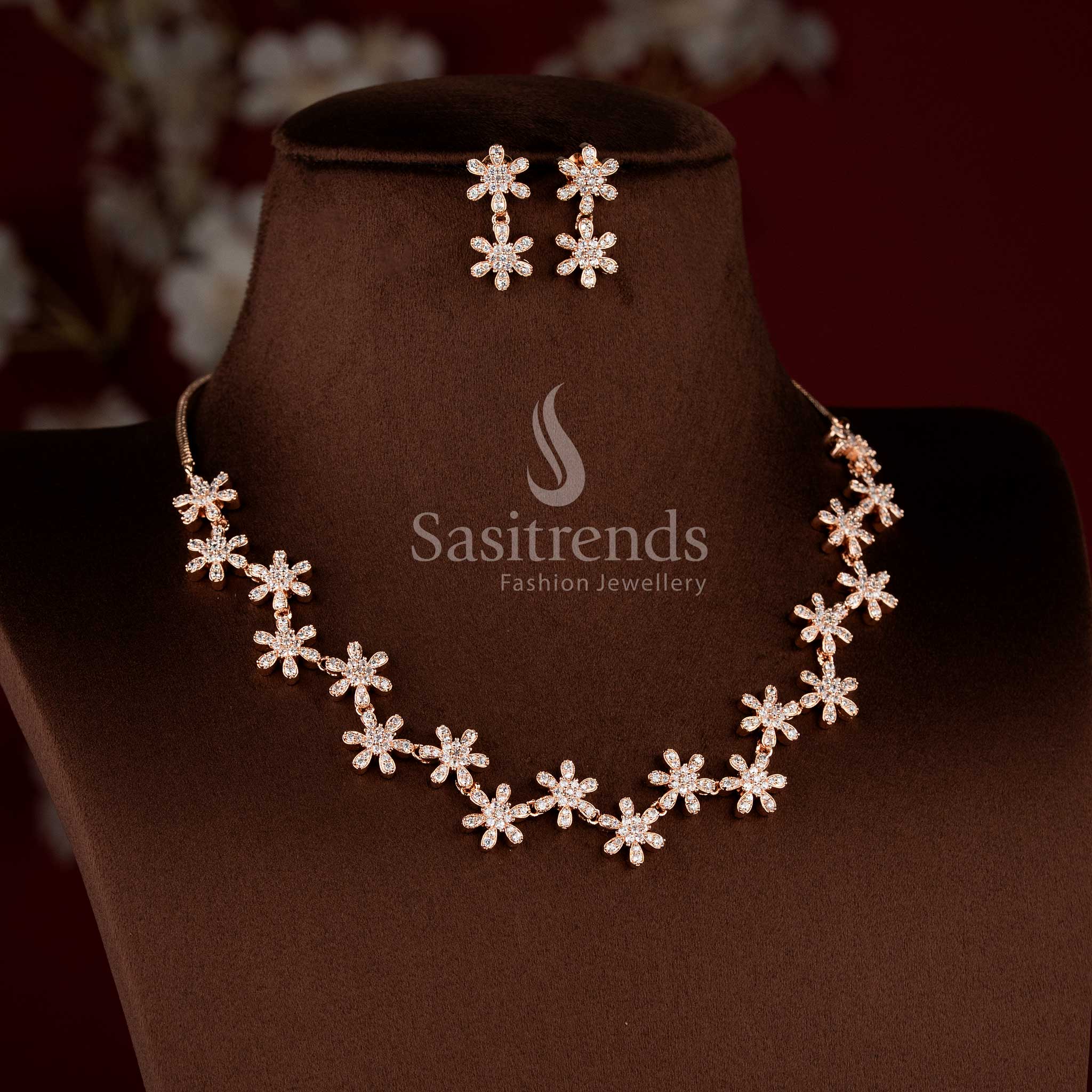 Traditional rose gold tone necklace jewellery set with white AD stones and matching earrings.