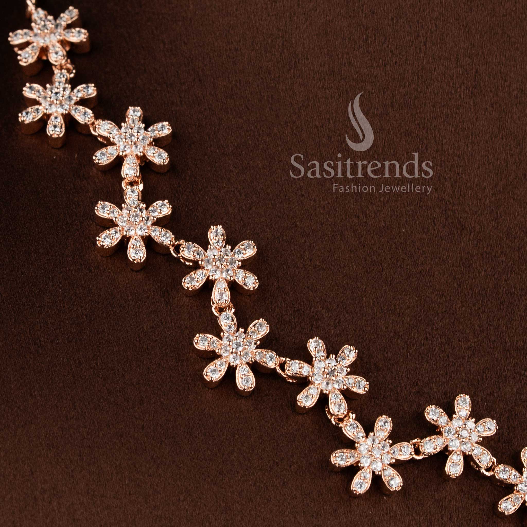 Traditional rose gold tone necklace jewellery set with white AD stones and matching earrings. 