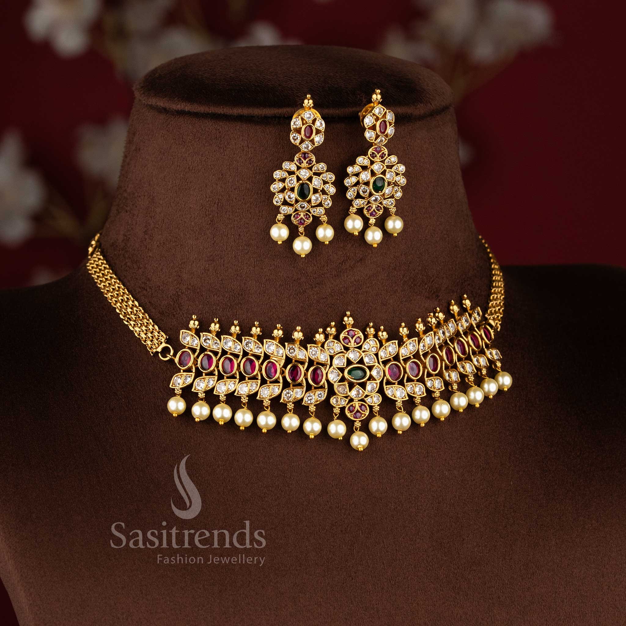 Grand temple matte gold tone choker necklace set with oval patterns and pearl detailing by Sasitrends.