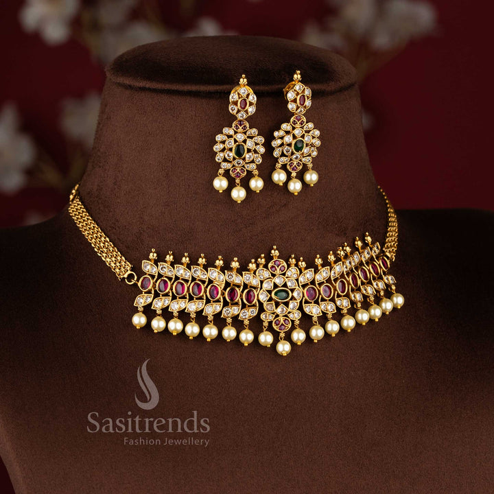 Grand temple matte gold tone choker necklace set with oval patterns and pearl detailing by Sasitrends.
