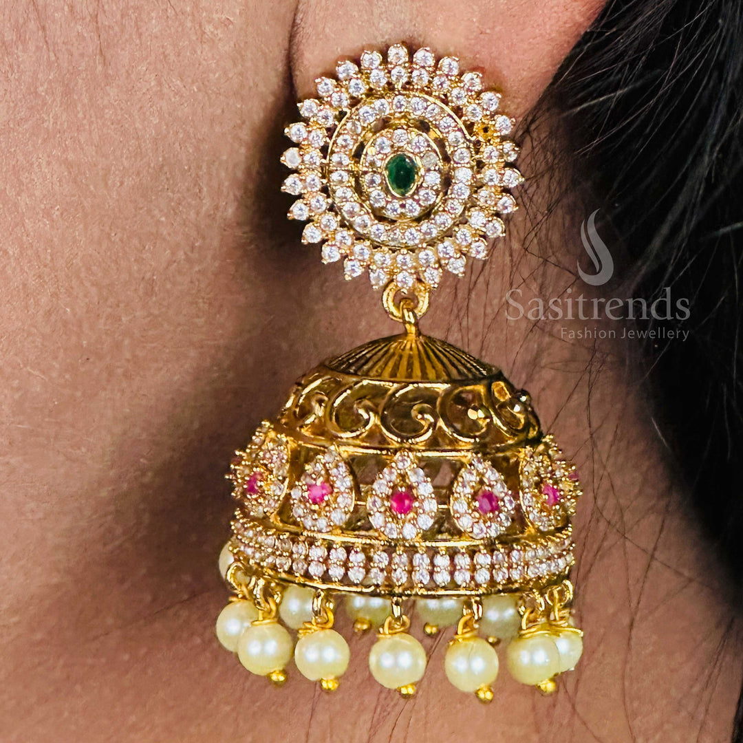 Temple matte gold plated charming Big AD-studded jhumka earrings with pearl hangings, designed in elegant South Indian ethnic style for weddings and divine occasions – Sasitrends