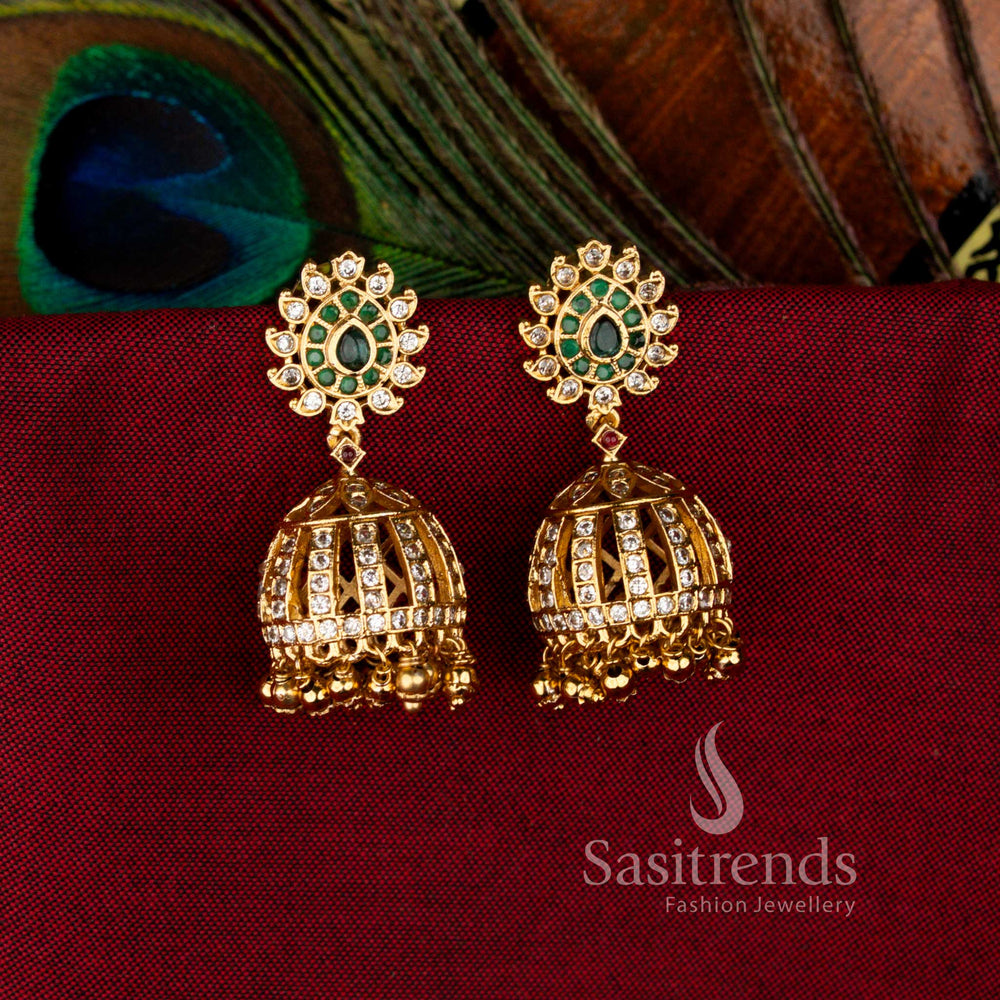 Multi-Colour Temple-Inspired Matte Gold Dome Jhumka Earrings with AD Stone-Studded Floral Pattern and Hanging Ghungroos, Perfect Statement Jewellery for Parties and Celebrations – Sasitrends
