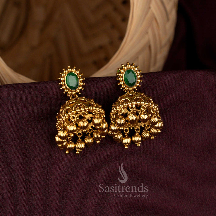 Elegant Matte Gold Plated Oval Stud Temple Jhumka Earrings AD Stone with Floral Dome and Bead Danglers