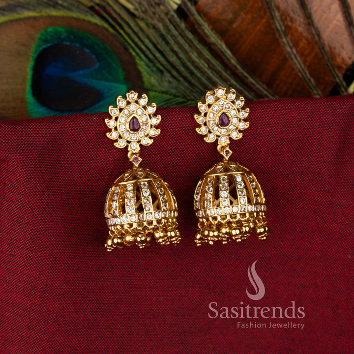 Premium Temple Matte Gold Plated Floral Studded AD Stone Dome Jhumka Earrings with Hanging Ghungroos