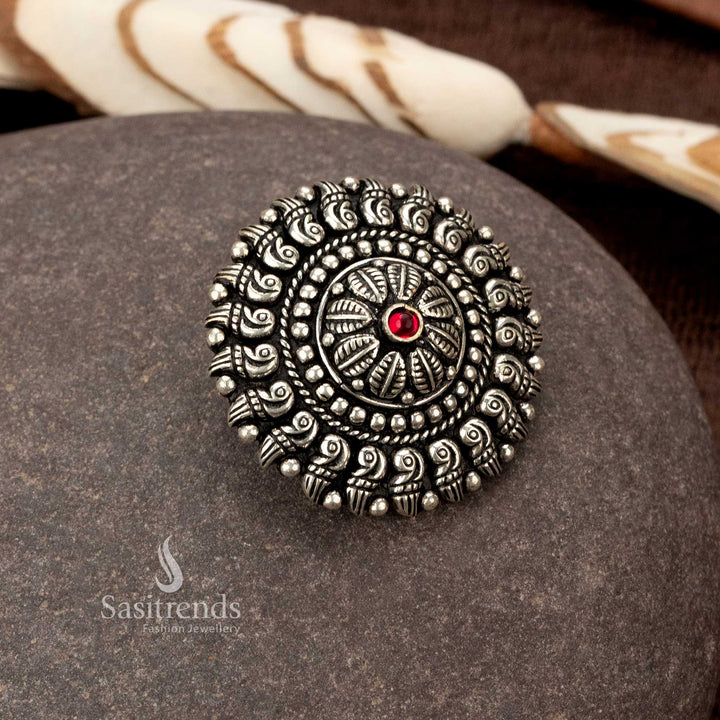 Traditional oxidised ring featuring paisley designs and a round red stone - Sasitrends