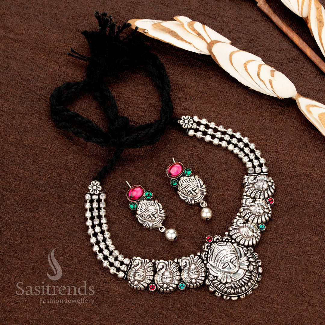 Kolapuri oxidised choker set with tribal face and peacock motifs - Sasitrends