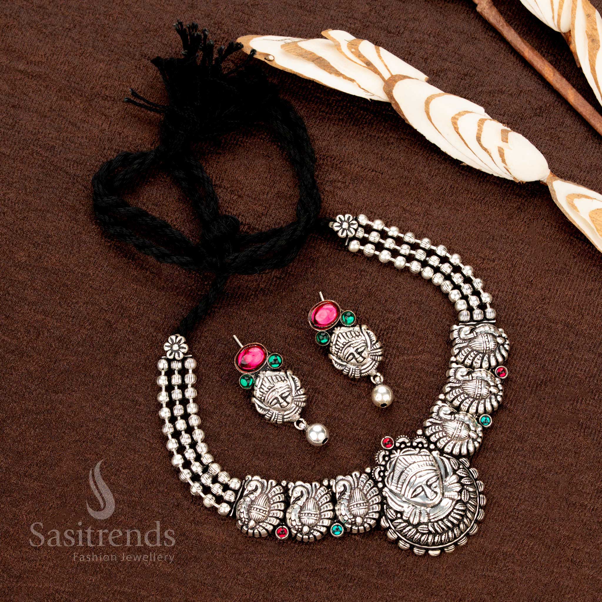 Kolapuri oxidised choker set with tribal face and peacock motifs - Sasitrends