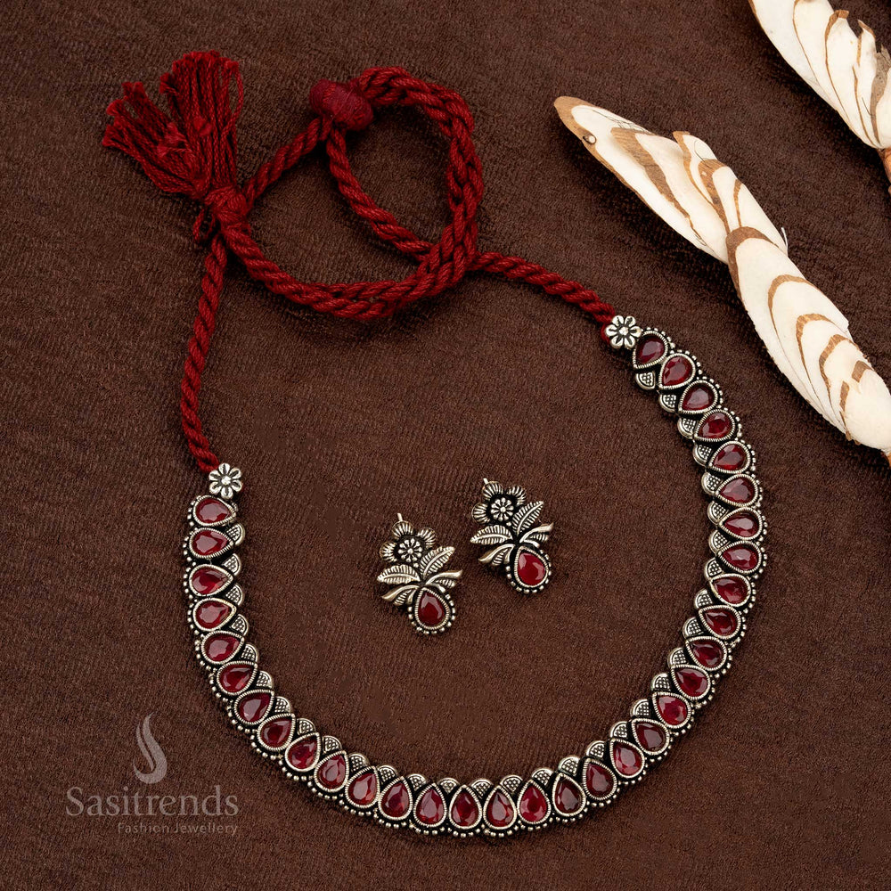 Grand heritage-style German silver oxidised necklace set with rich ruby-hued Monalisa stones, designed for festive and wedding occasions - Sasitrends