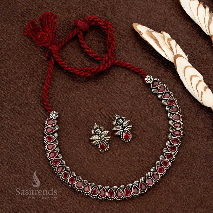 Grand heritage-style German silver oxidised necklace set with rich ruby-hued Monalisa stones, designed for festive and wedding occasions - Sasitrends