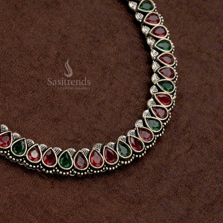 Handcrafted oxidised German silver necklace jewellery set with dazzling ruby-green Monalisa stones, a perfect fusion of vintage elegance and modern charm - Sasitrends