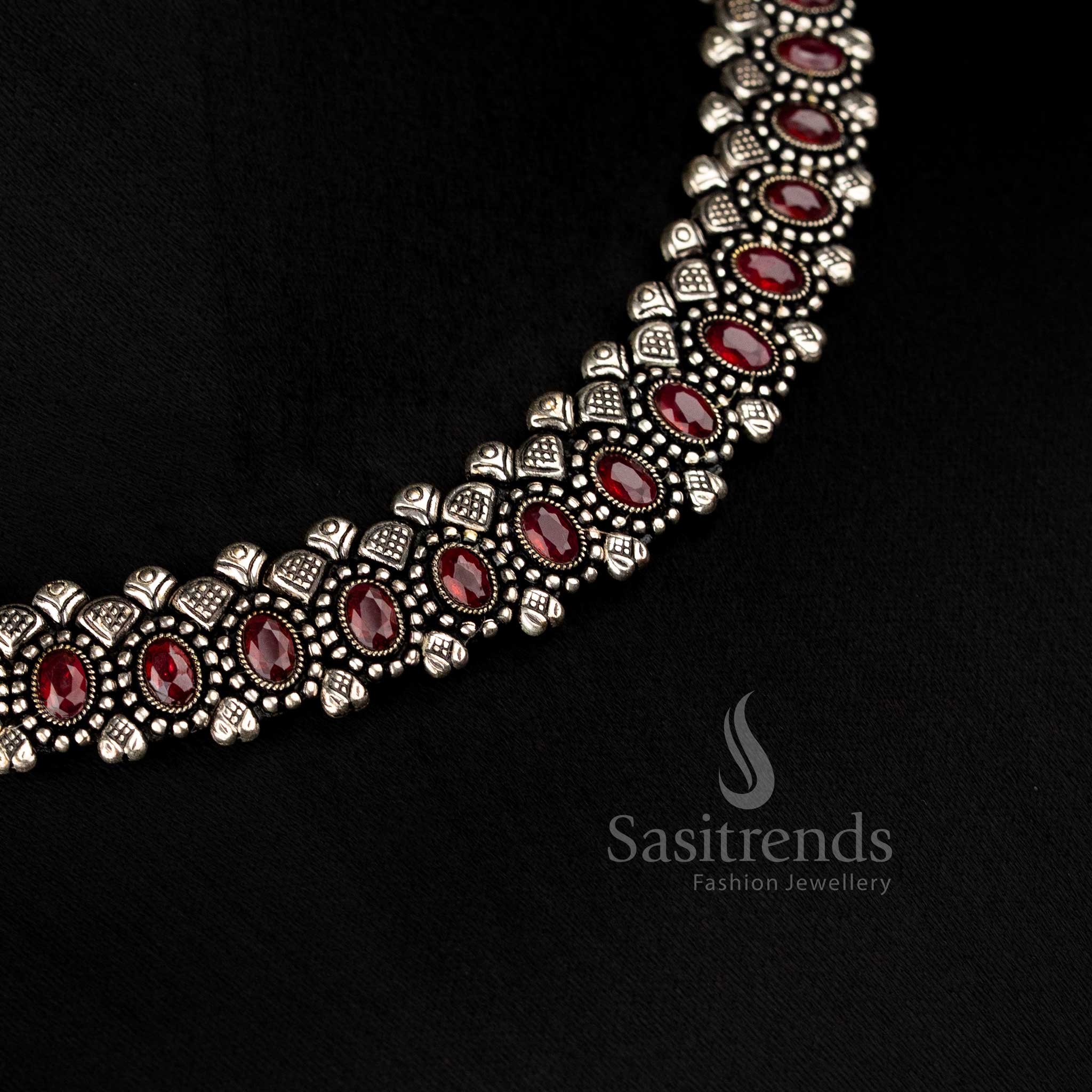 Oxidised oval stone necklace set with thread closure and matching earrings, featuring deep ruby-colored stones, perfect for ethnic and festive jewellery collections - Sasitrends 