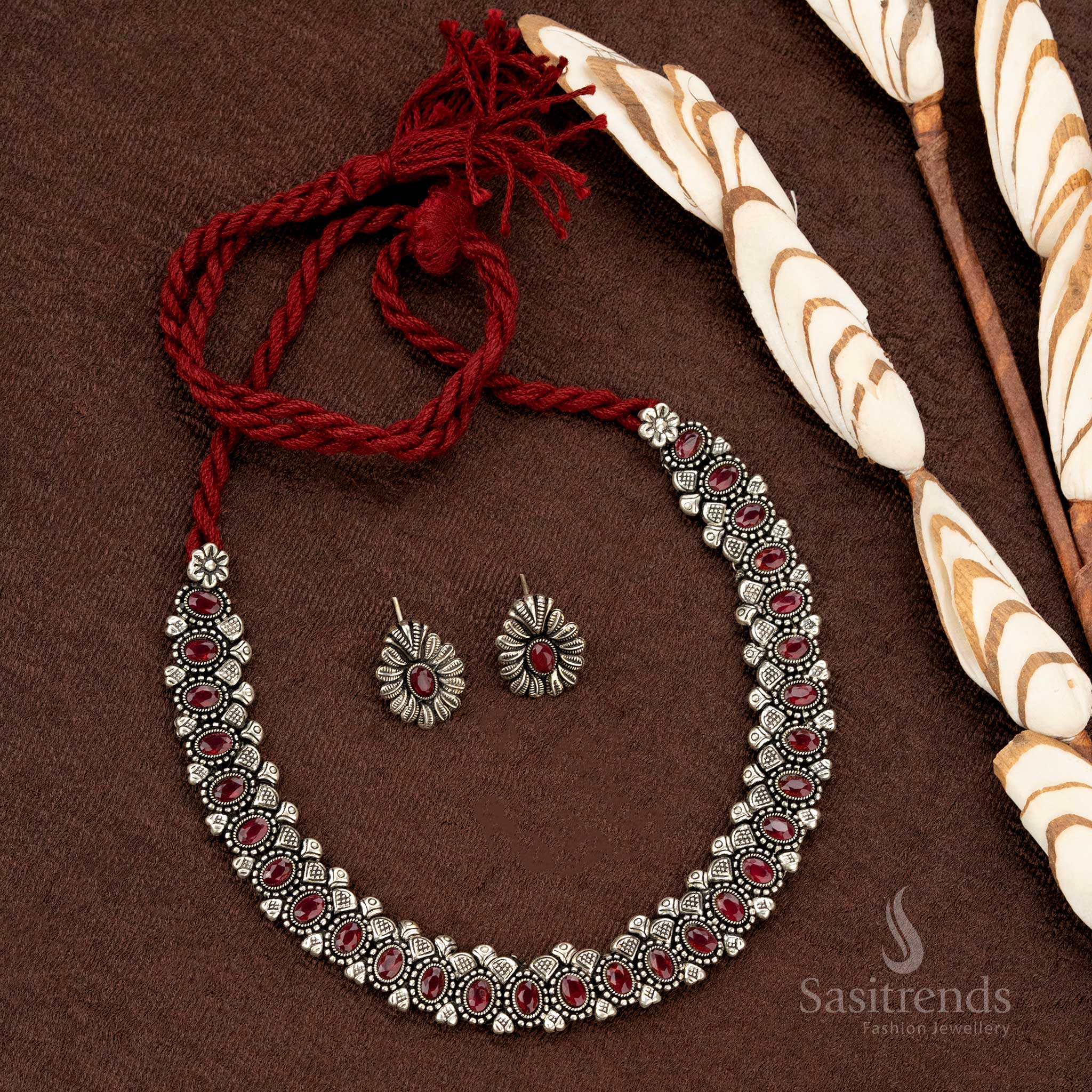 Oxidised oval stone necklace set with thread closure and matching earrings, featuring deep ruby-colored stones, perfect for ethnic and festive jewellery collections - Sasitrends