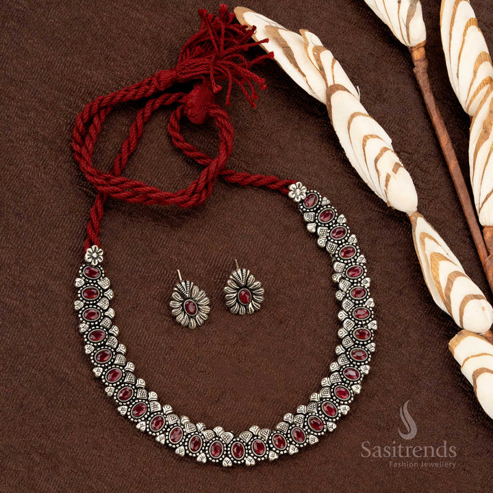 Oxidised oval stone necklace set with thread closure and matching earrings, featuring deep ruby-colored stones, perfect for ethnic and festive jewellery collections - Sasitrends