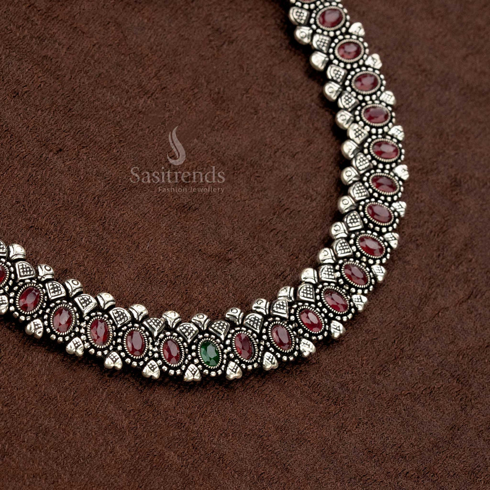 Elegant oxidised necklace set with stunning ruby oval stones, a secure thread closure, and matching earrings, offering a royal and timeless appeal - Sasitrends