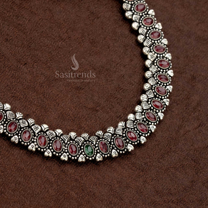 Elegant oxidised necklace set with stunning ruby oval stones, a secure thread closure, and matching earrings, offering a royal and timeless appeal - Sasitrends