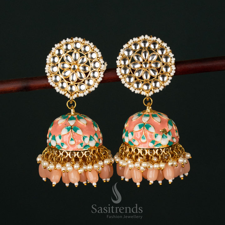 Captivating pink-blue gold plated pearl jhumka earrings featuring a handcrafted kundan design, blending royal aesthetics with ethnic grace - Sasitrends