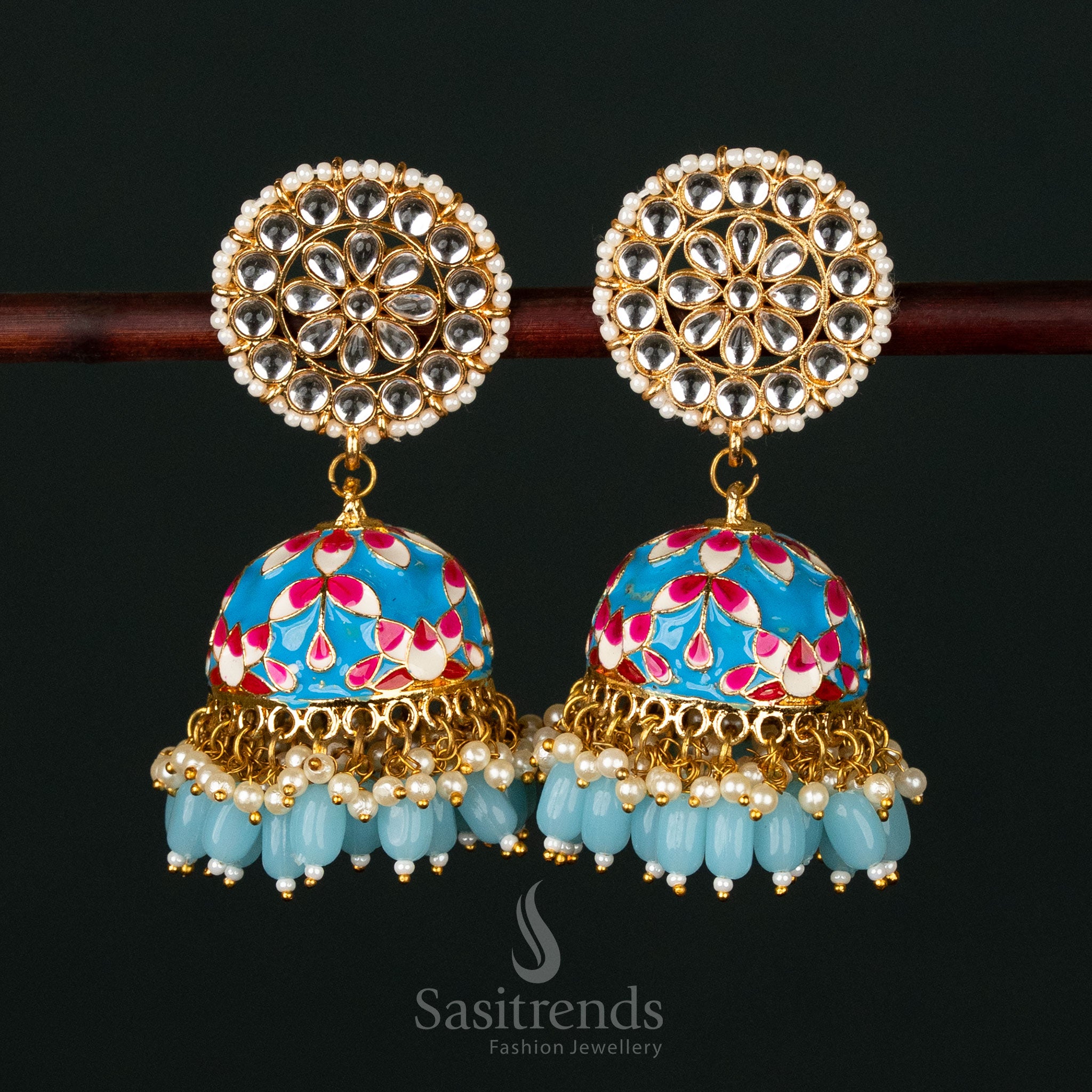 Magnificent blue-dark pink gold plated pearl jhumka earrings with kundan stonework, an essential accessory for grand traditional weddings - Sasitrends